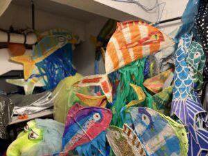 Colorful fish puppets created with paper mache
