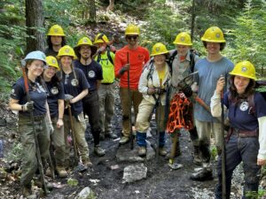 Maine Conservation Corps & 7 Lakes Alliance Trail workers wearing hard hats